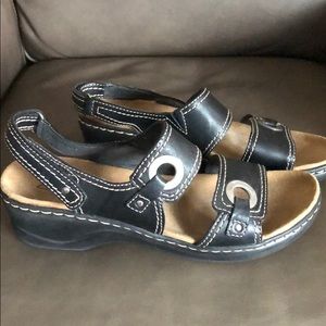 Clark’s black leather sandals